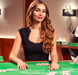 Live baccarat game in progress with real dealer